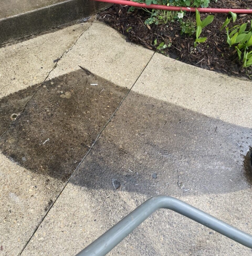 Concrete sidewalk and patio before and after pressure washing in Fond du Lac, Wisconsin, showing dirt and mold removal results