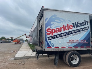 SparkleWash pressure washing truck parked at Fond du Lac, Wisconsin location offering residential and commercial exterior cleaning services